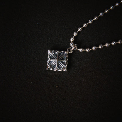 DUSTY SILVER CROSS LOCKET